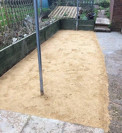 The same strip cleared and levelled with a sand base