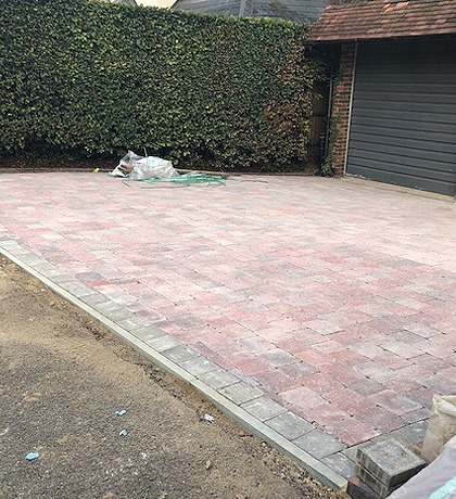 The new block-paved drive with a contrasting edge, ready for the last strip