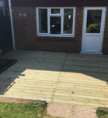 New timber decking across the back of a house